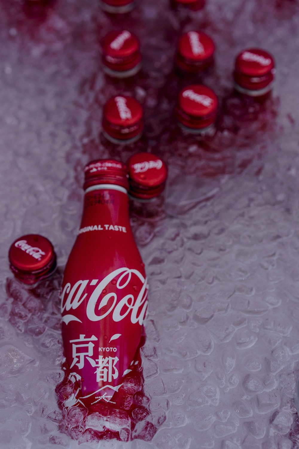 coca cola bottle on white textile