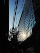 A sleek nanogrid installation powering a modern office building at dusk.