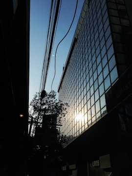 A sleek nanogrid installation powering a modern office building at dusk.