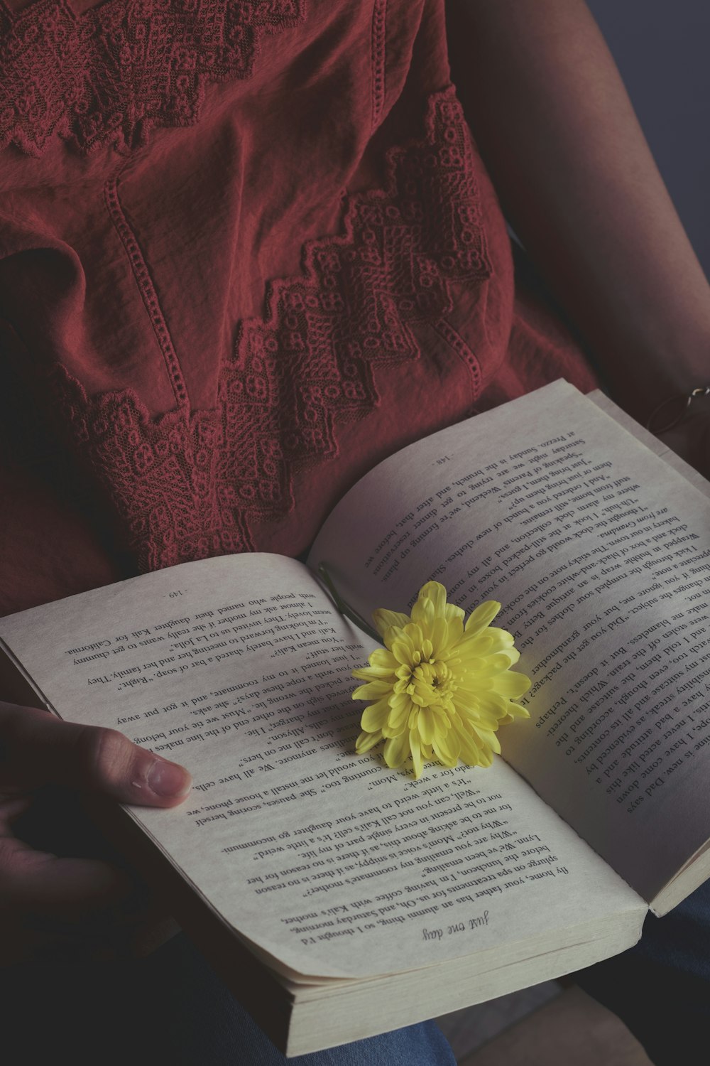 yellow flower on white book page