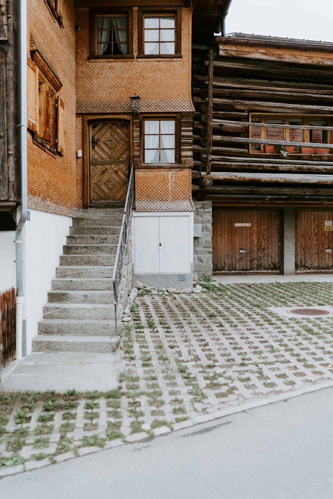 brown brick house with white wooden door