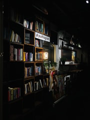 books on black wooden shelf