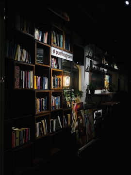 books on black wooden shelf