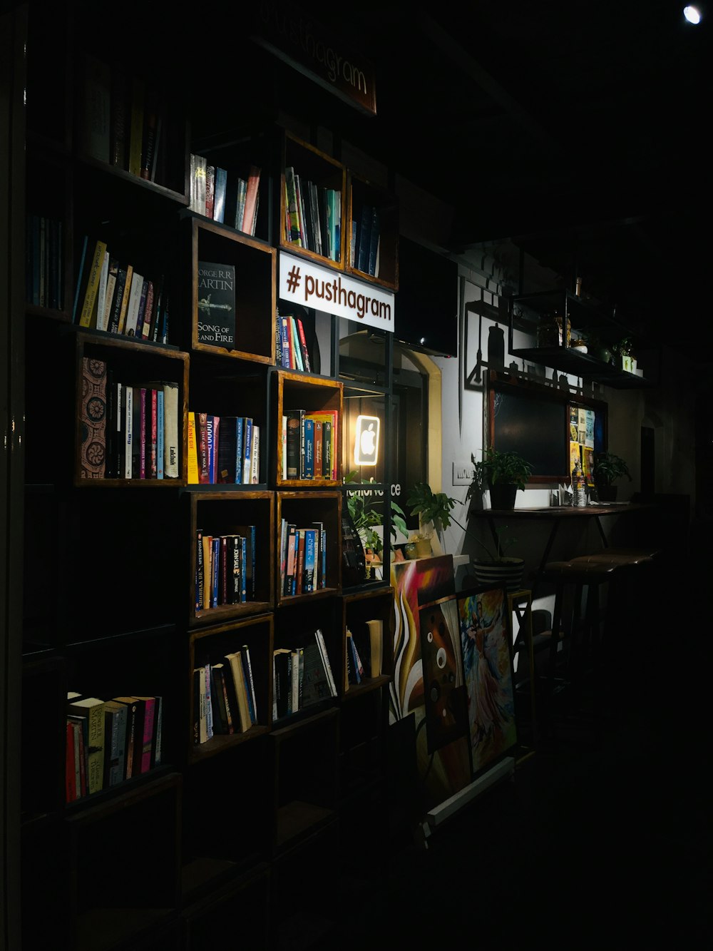 books on black wooden shelf