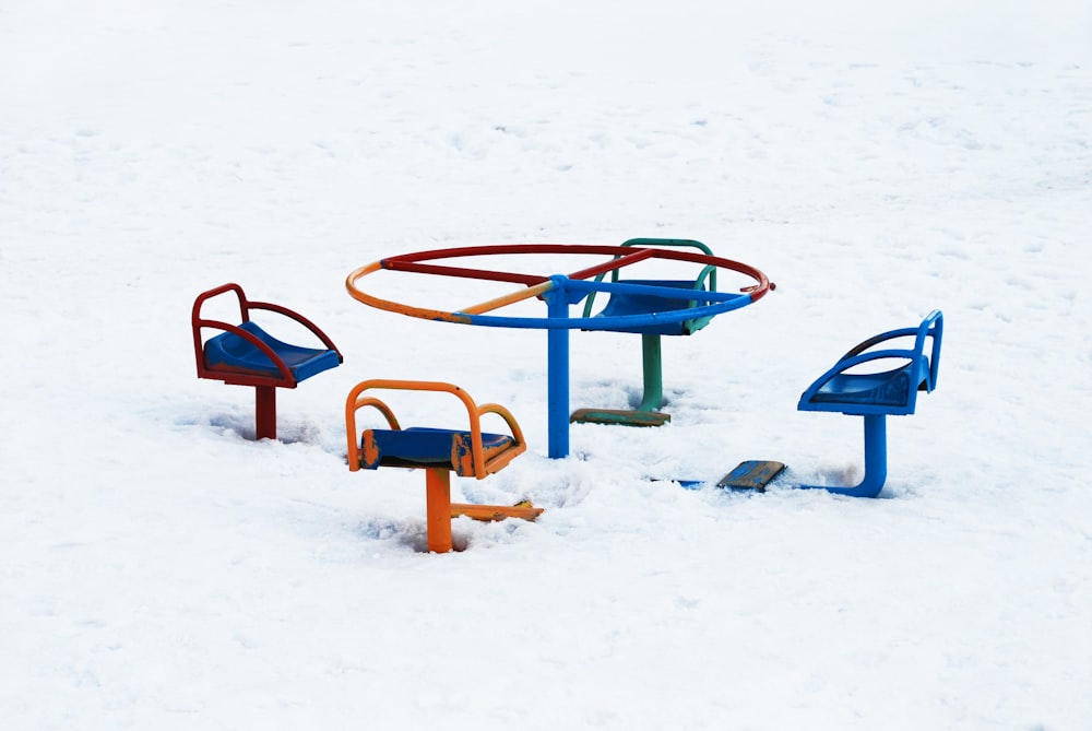red and blue metal frame on snow covered ground