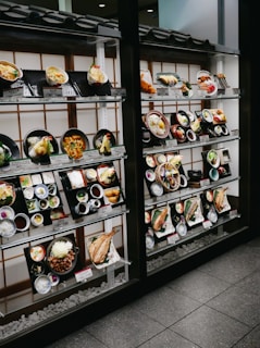 assorted food on black wooden shelf