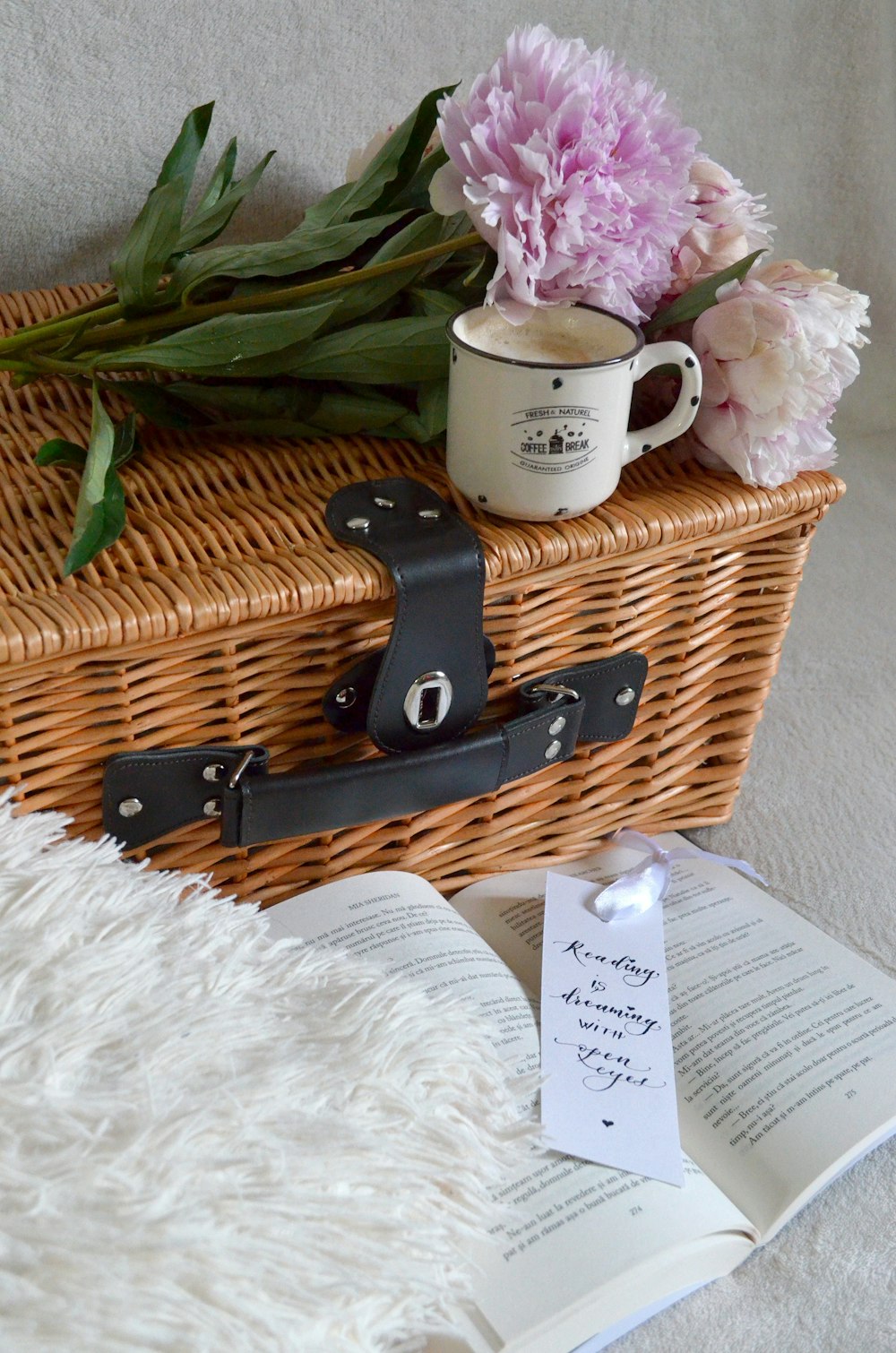 brown woven basket on white textile