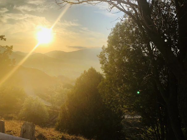 A serene sunset view with silhouettes of the attraction’s iconic features.