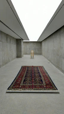 A serene Swiss interior featuring a minimalist room adorned with a vintage Afghan rug.