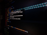 Close-up of a Python code editor screen with colorful syntax highlighting.