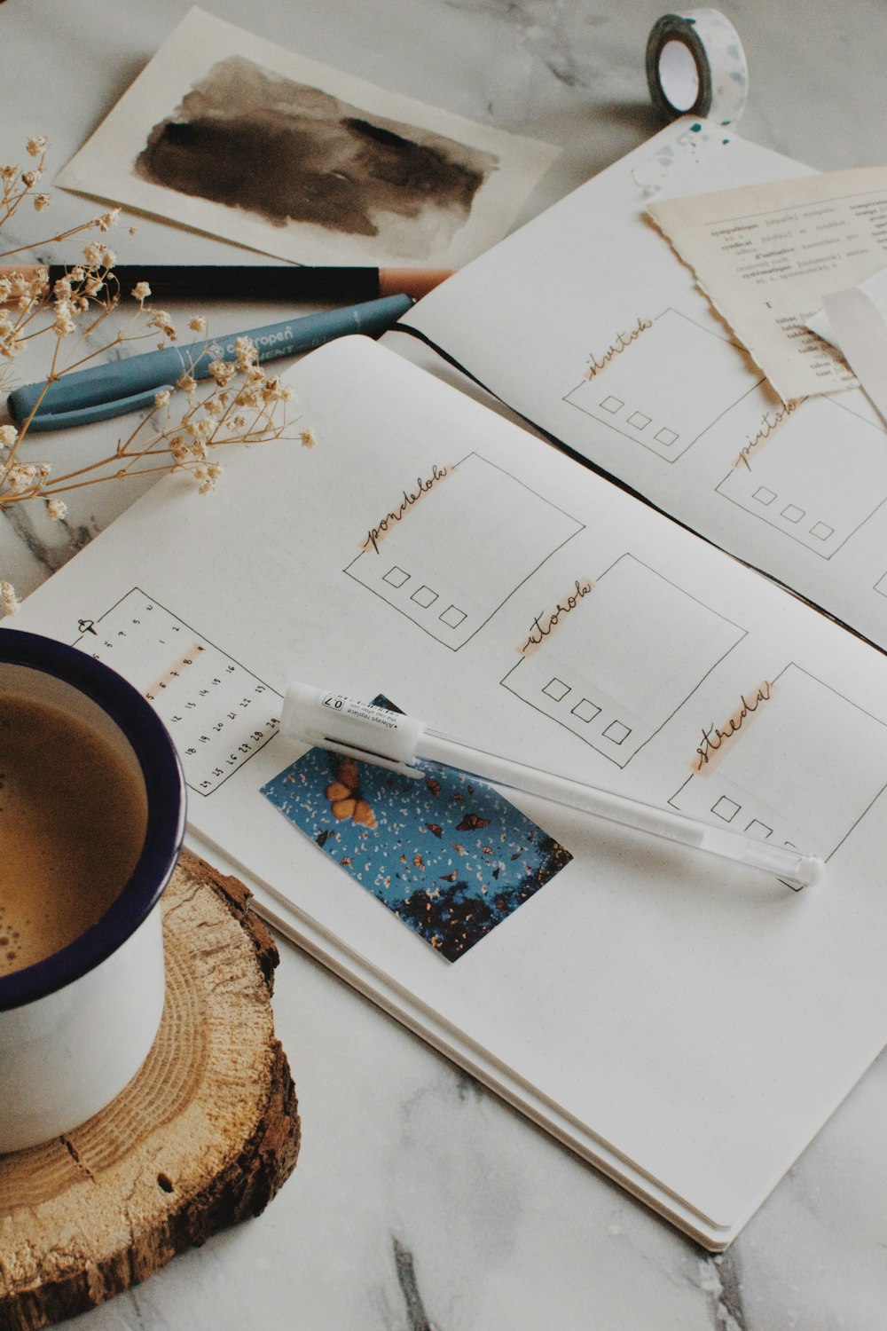 white ceramic mug on white paper