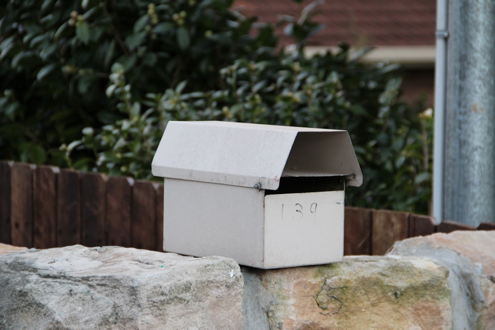 white box on gray concrete bench