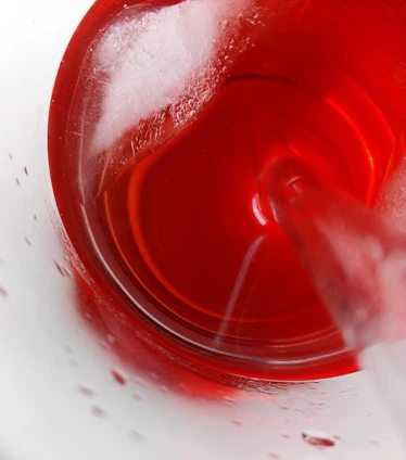 Close-up of vibrant frozen detox blends swirling in a glass, highlighting fresh natural ingredients.