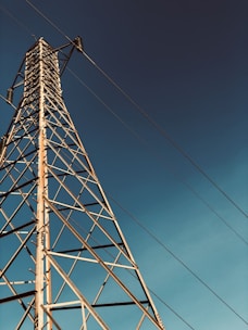 gray metal tower under blue sky during daytime
