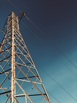 gray metal tower under blue sky during daytime