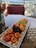 A satisfied customer enjoying a fruit platter from Primafelicitas.