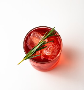 red liquid in clear glass jar