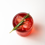 red liquid in clear glass jar