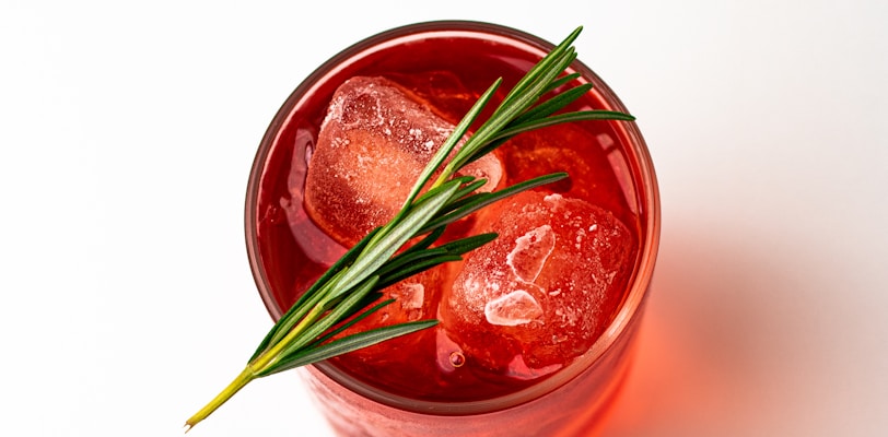 red liquid in clear glass jar