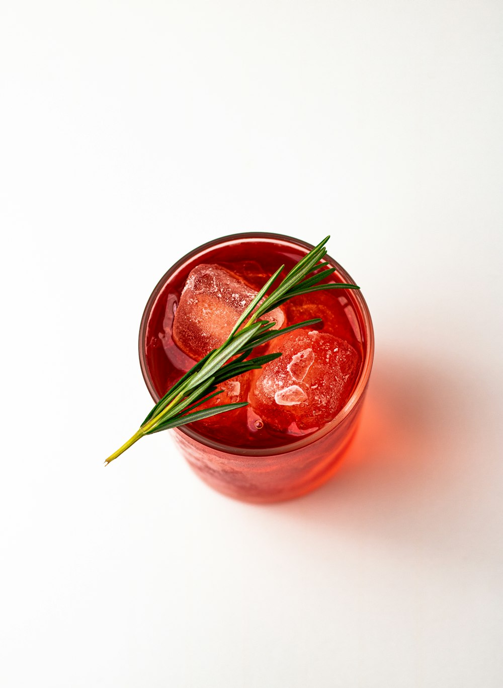 red liquid in clear glass jar