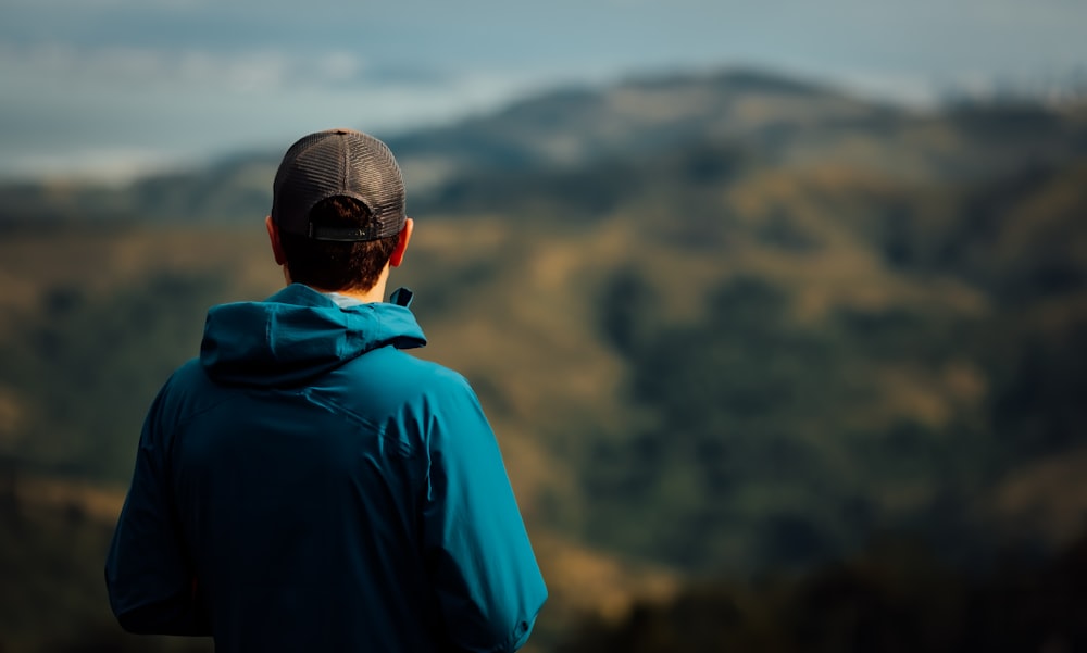 man in blue hoodie wearing black sunglasses