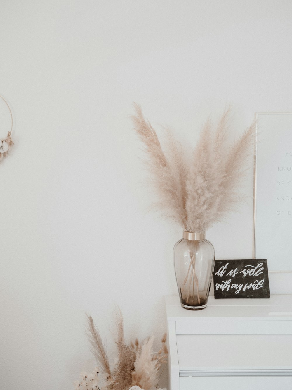 white feather on white surface