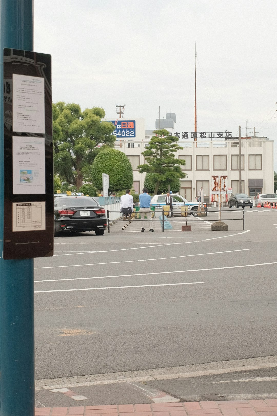 cars parked on parking lot during daytime