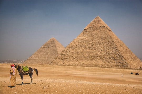 brown pyramid in the middle of desert in Giza Necropolis Egypt