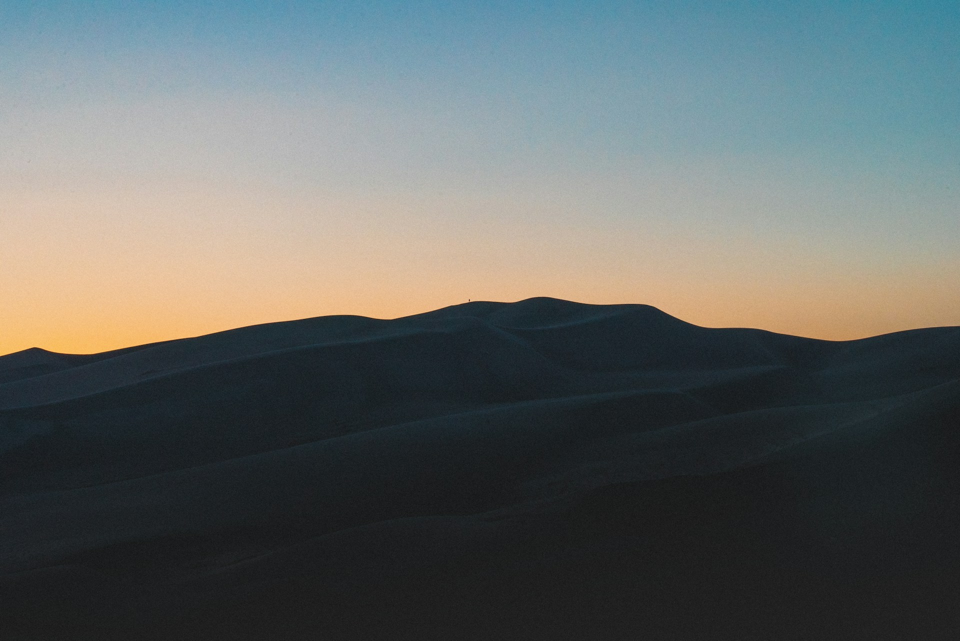 silhouette of mountain during sunset
