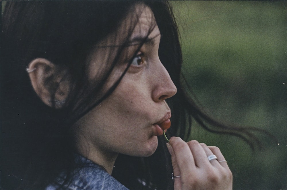 woman in black shirt smoking