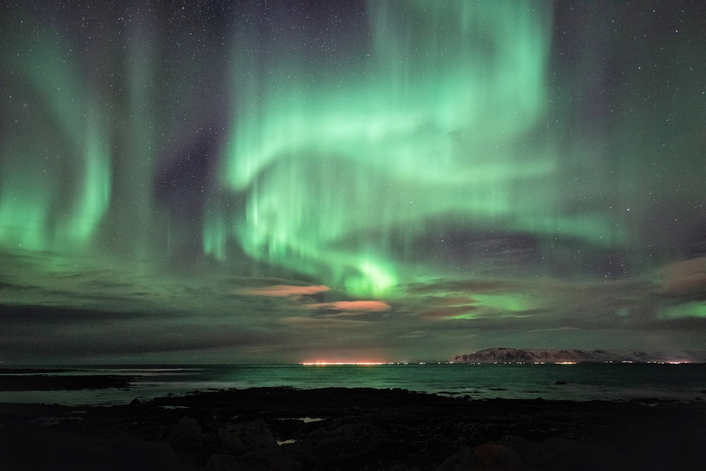 green and blue aurora lights