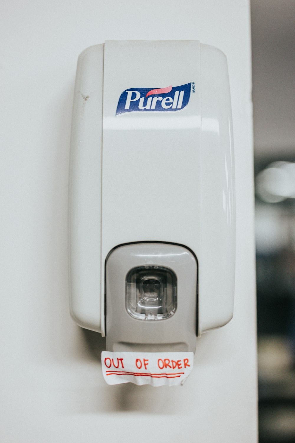 a close up of a paper dispenser on a wall