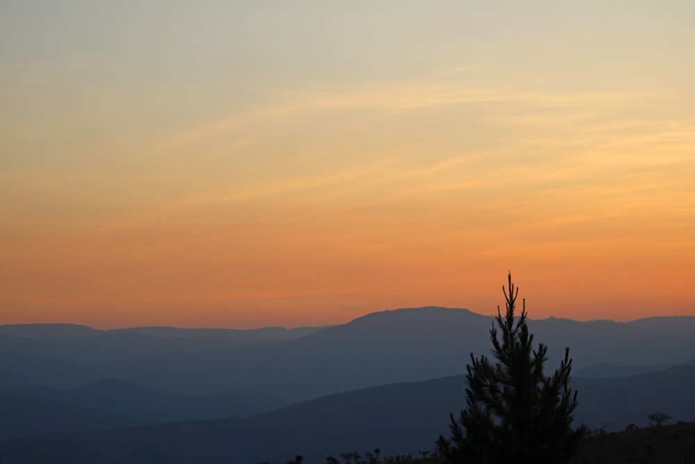 silhouette of mountain during sunset