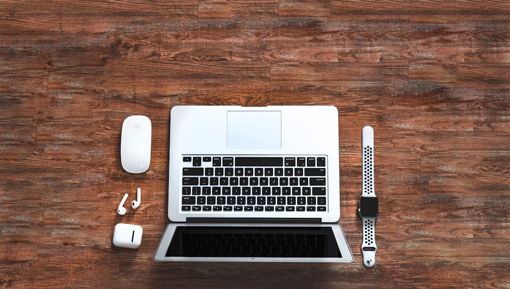 macbook pro beside apple magic mouse and apple magic mouse