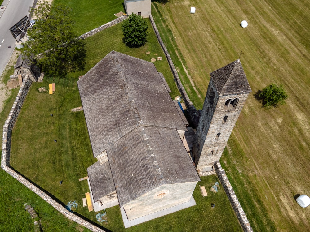 gray concrete tomb on green grass field during daytime