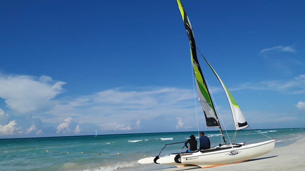 white and black boat on sea during daytime