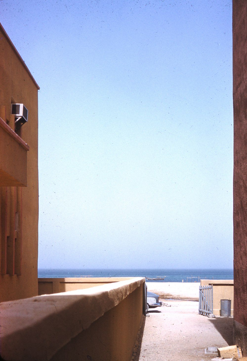 brown wooden house near sea during daytime