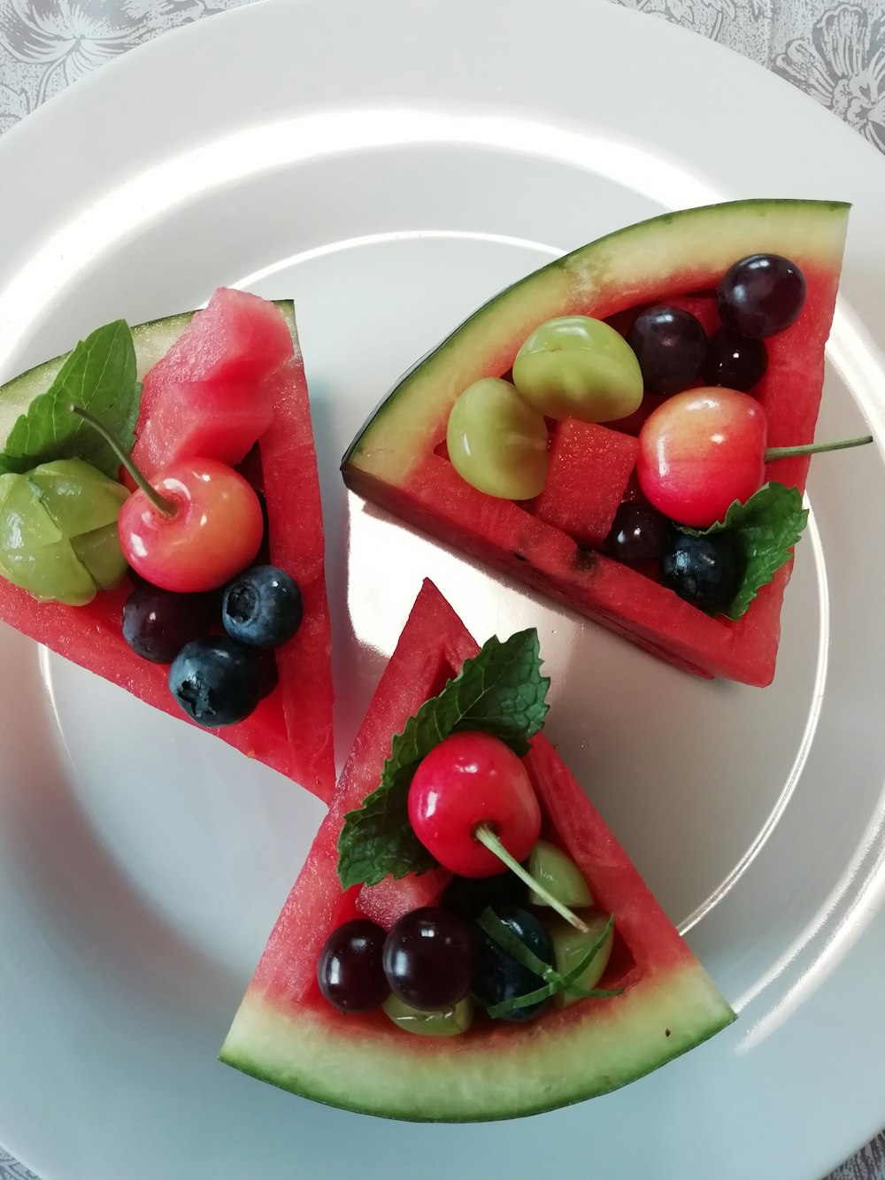 sliced fruits on green ceramic plate