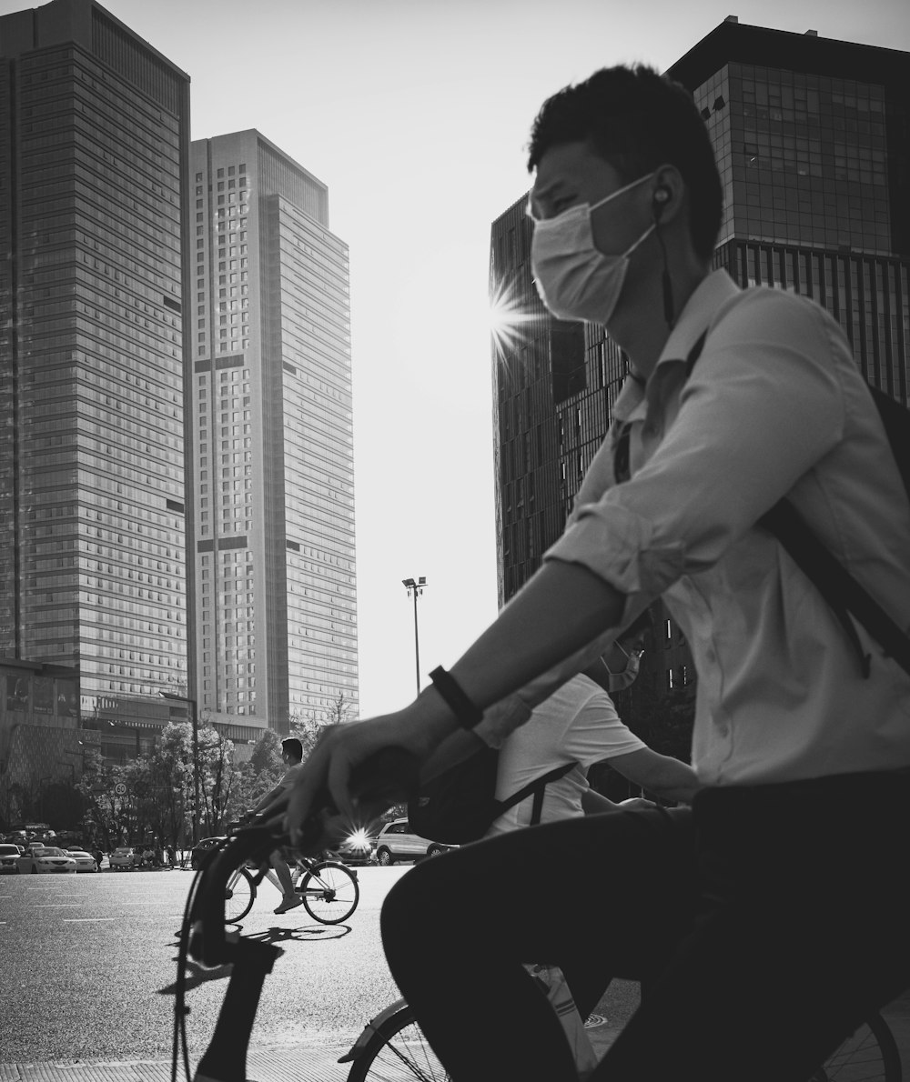 man in white dress shirt riding on motorcycle