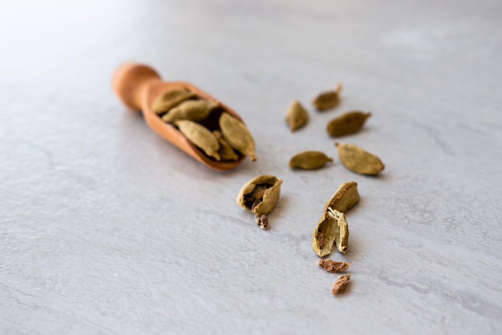 brown nuts on white textile