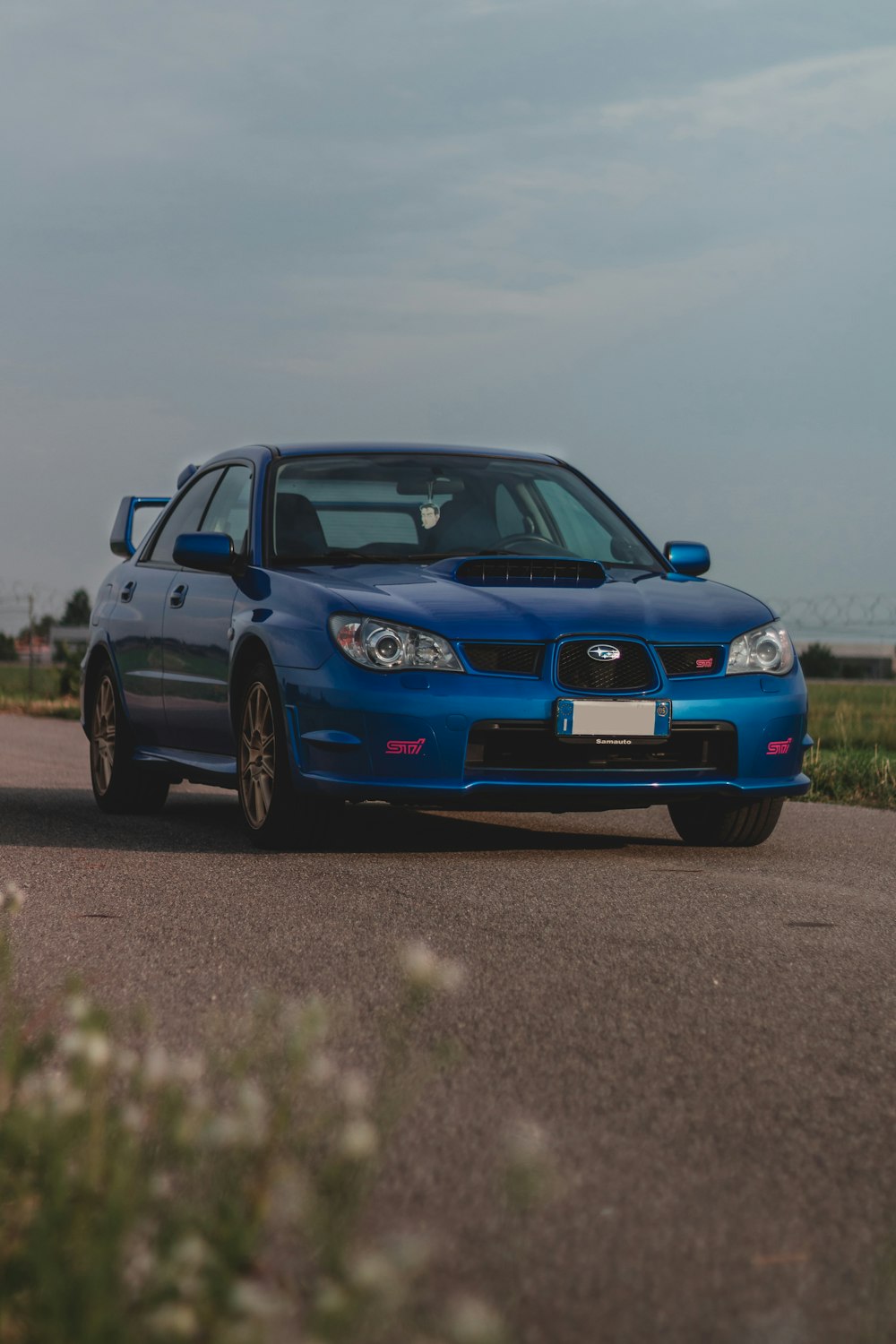 blue bmw m 3 on road