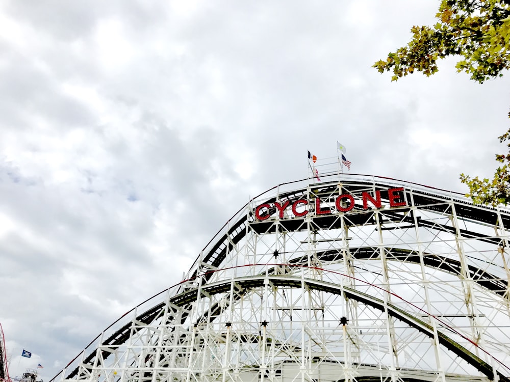 white and red stadium under white clouds during daytime