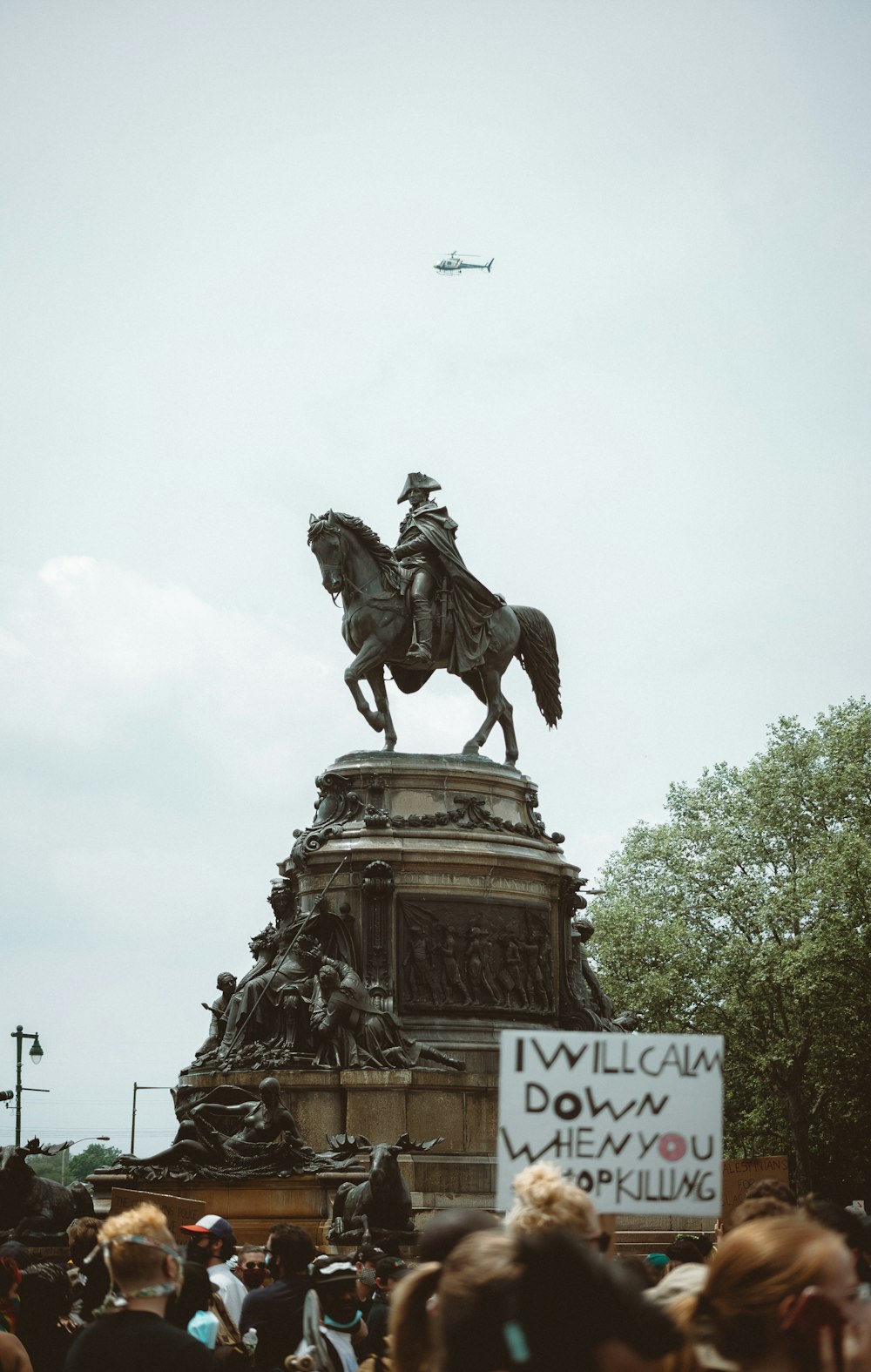 man riding horse statue during daytime