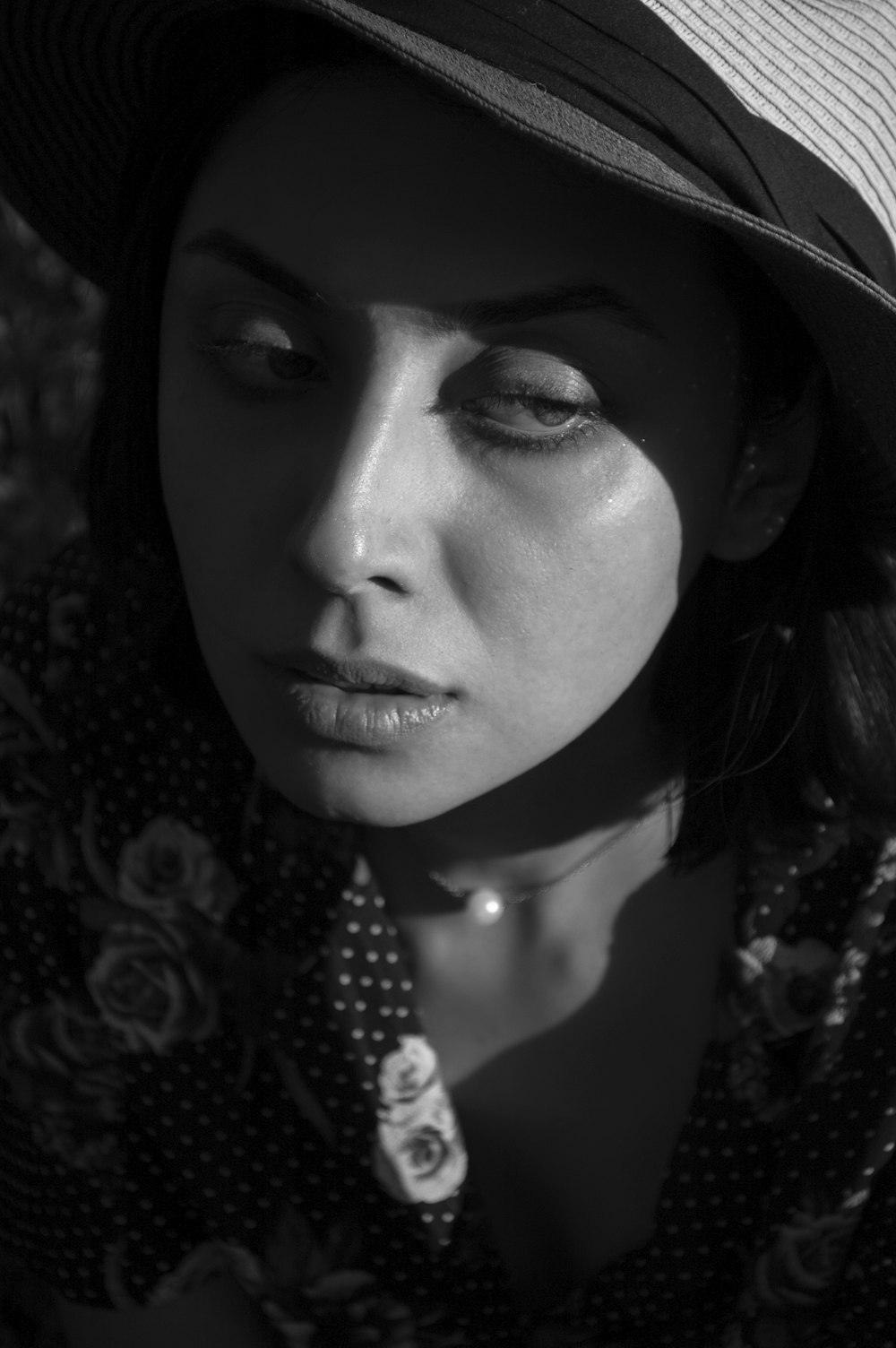 woman in black and white floral shirt