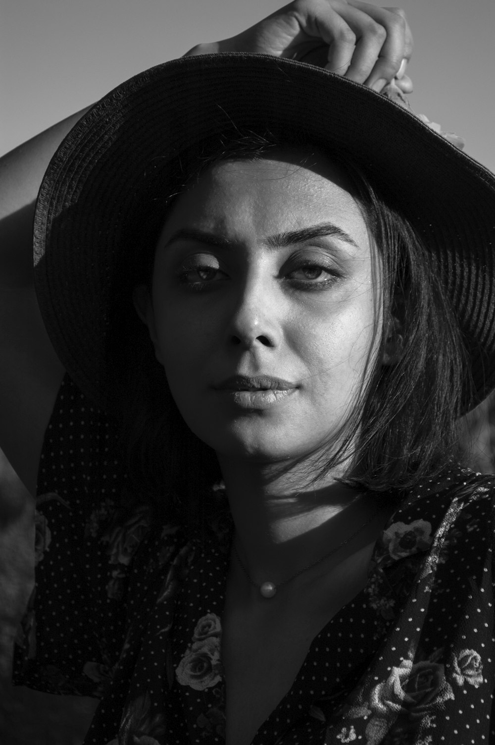 grayscale photo of woman wearing black hat