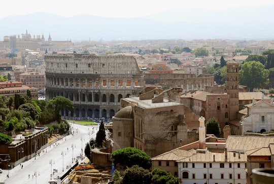 aerial view of city buildings during daytime in Colosseum Italy