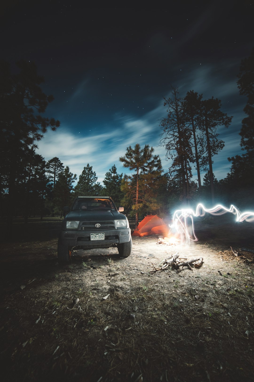 white car near bonfire during night time