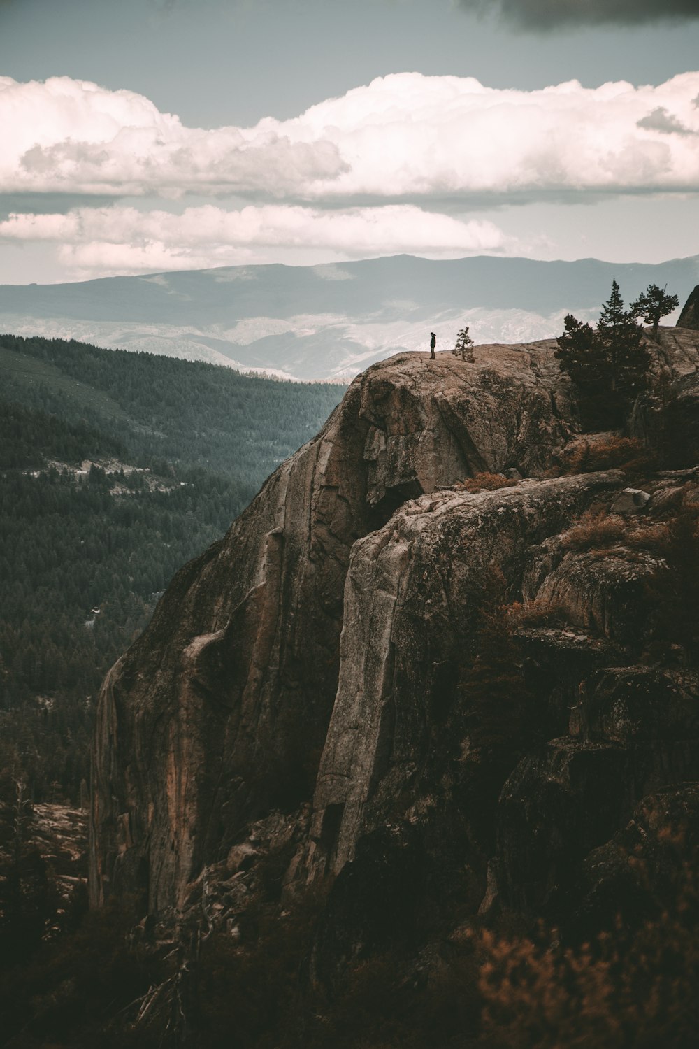 people standing on rock formation during daytime