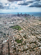 An aerial view of a cityscape with digital connections overlay, representing global reach.