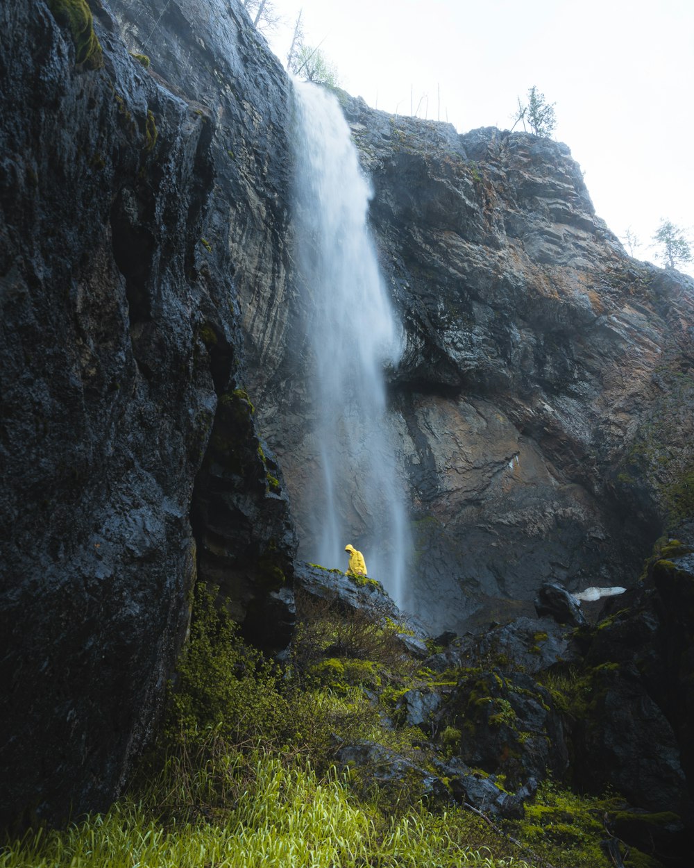 waterfalls on rocky mountain during daytime